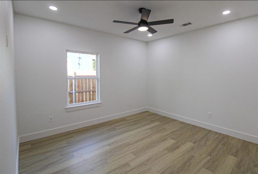 Unfurnished room featuring light wood-type flooring, recessed lighting, and ceiling fan Unfurnished room featuring light wood-type flooring, recessed lighting, and ceiling fan