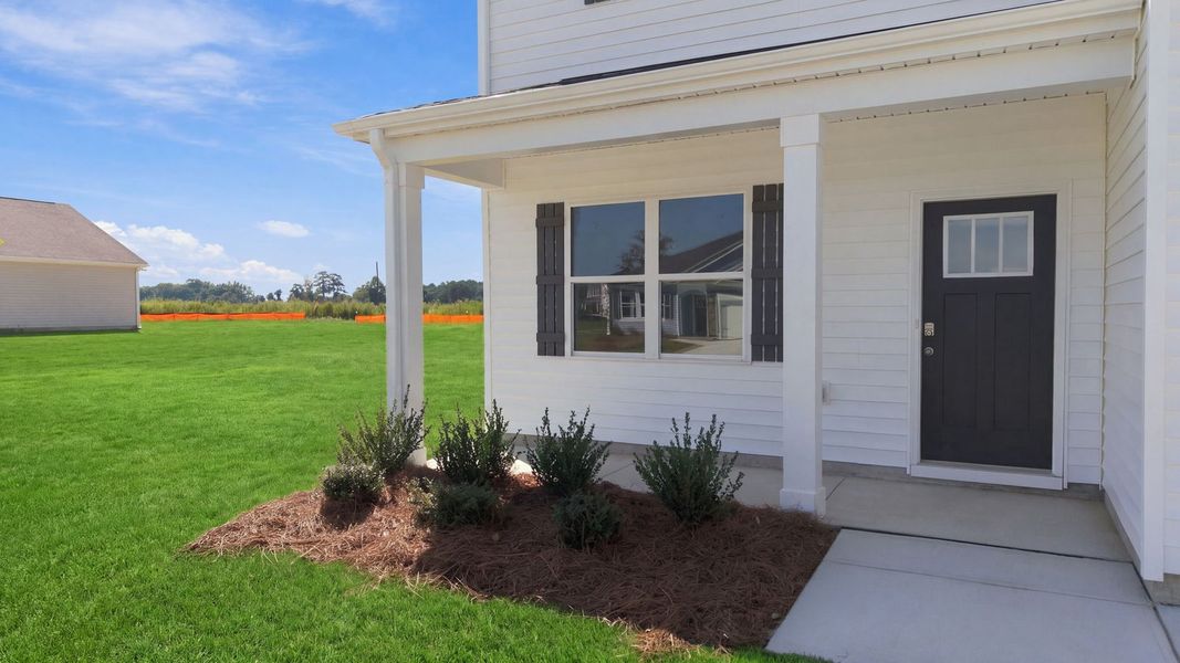 Exterior details and patio area of a home in East Ridge, Ayden (Image 3).