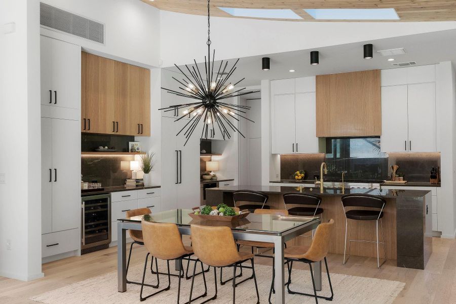 The stunning modern kitchen opens beautifully to the dining area and living room making for seamless connectivity throughout the main living area.