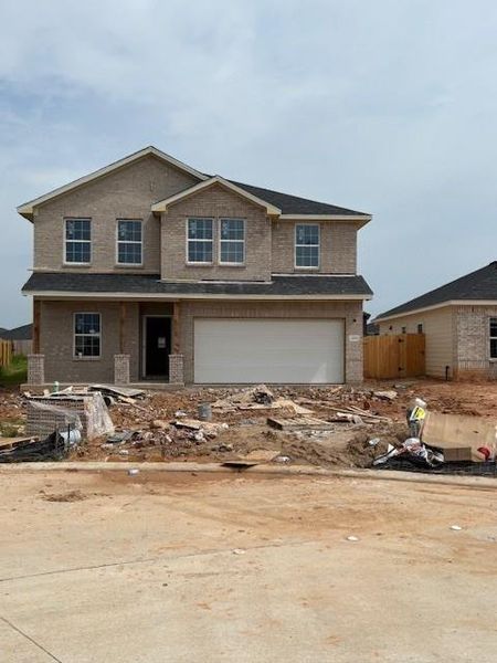Front exterior of a new home in Bluestem, Brookshire, TX, highlighting curb appeal (Image 17). Front exterior of a new home in Bluestem, Brookshire, TX, highlighting curb appeal (Image 17).