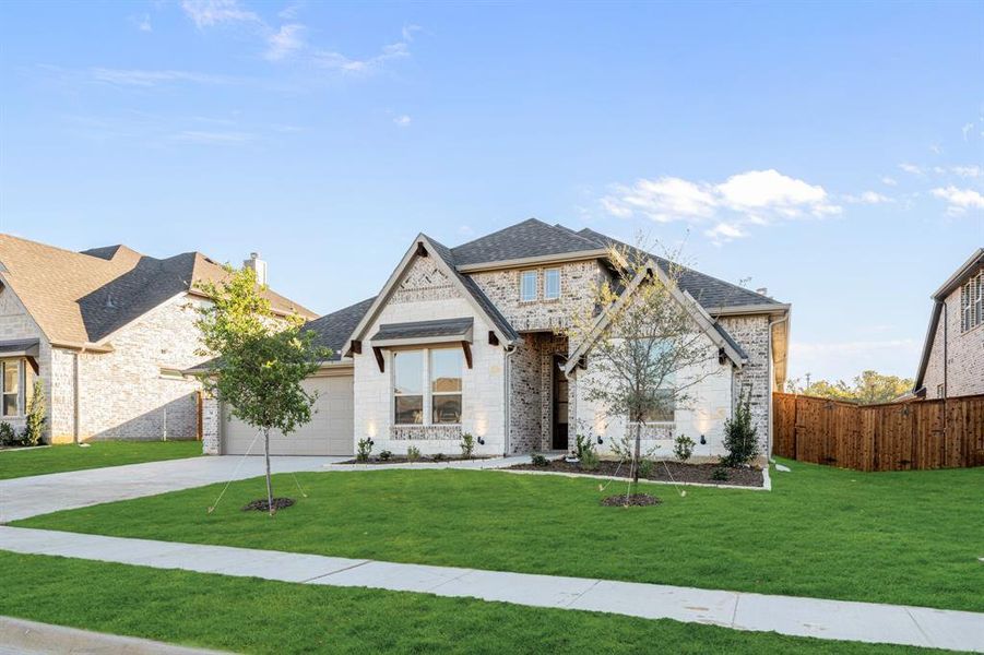 Front exterior of a new home in Mockingbird Hills 60-65, Joshua, TX, highlighting curb appeal (Image 1).