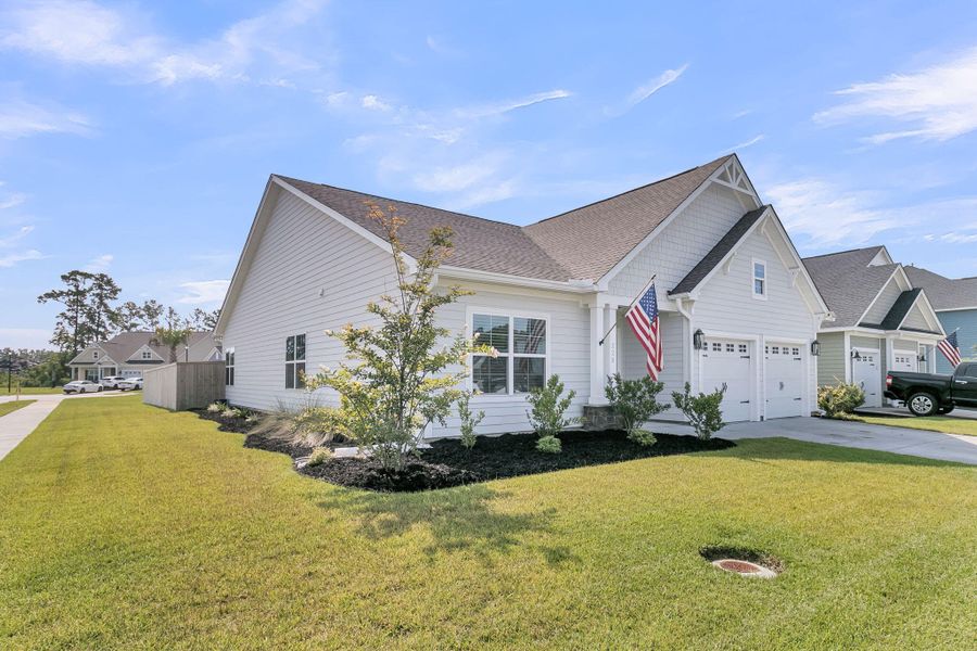 Front exterior of a new home in Hewing Farms, Summerville, SC, highlighting curb appeal (Image 18).