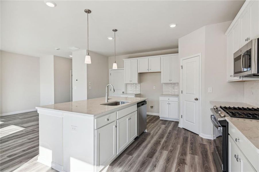 Furnished interior in a model home at City Square East in Hoschton (Image 7).