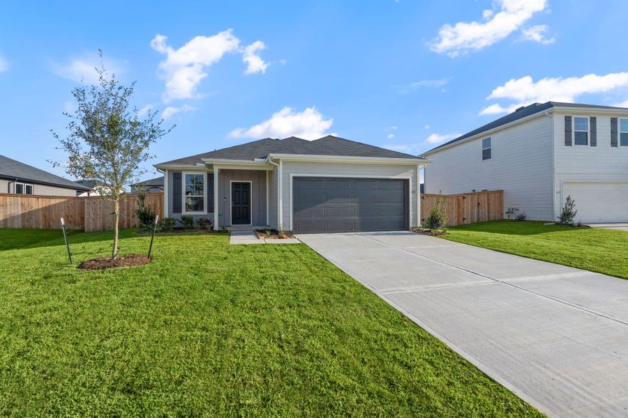 Front exterior of a new home in Windcress, Baytown, TX, highlighting curb appeal (Image 14).