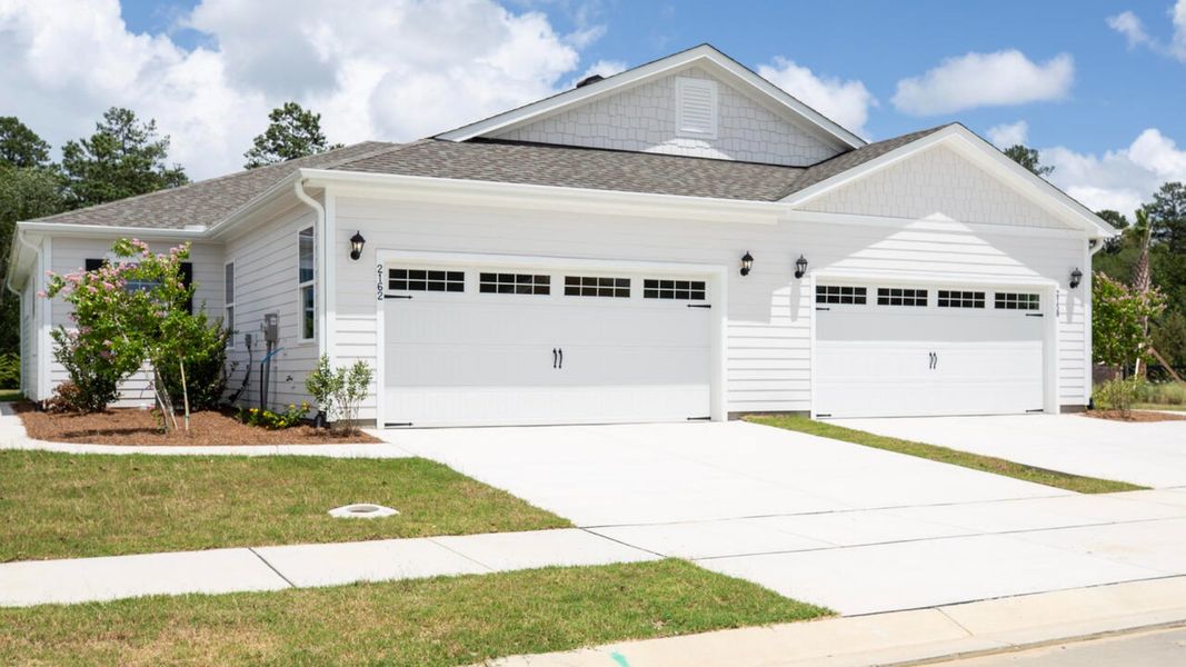 Representative exterior photo of a completed home built from the TUSCAN II by D.R. Horton in Indigo Preserve Townhomes, Leland, NC (Image 2).