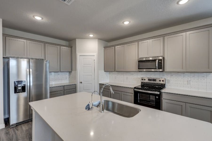 A kitchen with white cabinets. A kitchen with white cabinets.