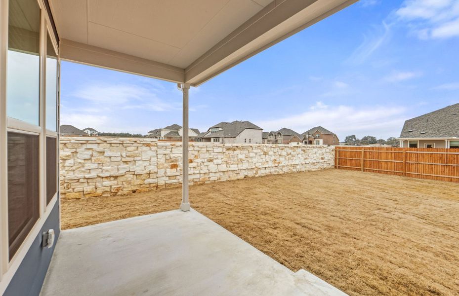 Exterior details and patio area of a home in Saddleback at Santa Rita Ranch, Liberty Hill (Image 27). Exterior details and patio area of a home in Saddleback at Santa Rita Ranch, Liberty Hill (Image 27).