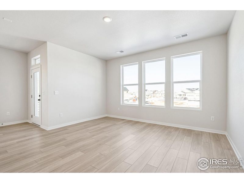 Spacious, unfurnished interior of a new home in Kinston Mainstreet Townhomes, Loveland (Image 25).