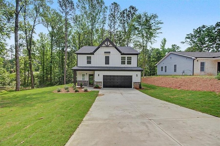 Front exterior of a new home in , Canton, GA, highlighting curb appeal (Image 2). Front exterior of a new home in , Canton, GA, highlighting curb appeal (Image 2).