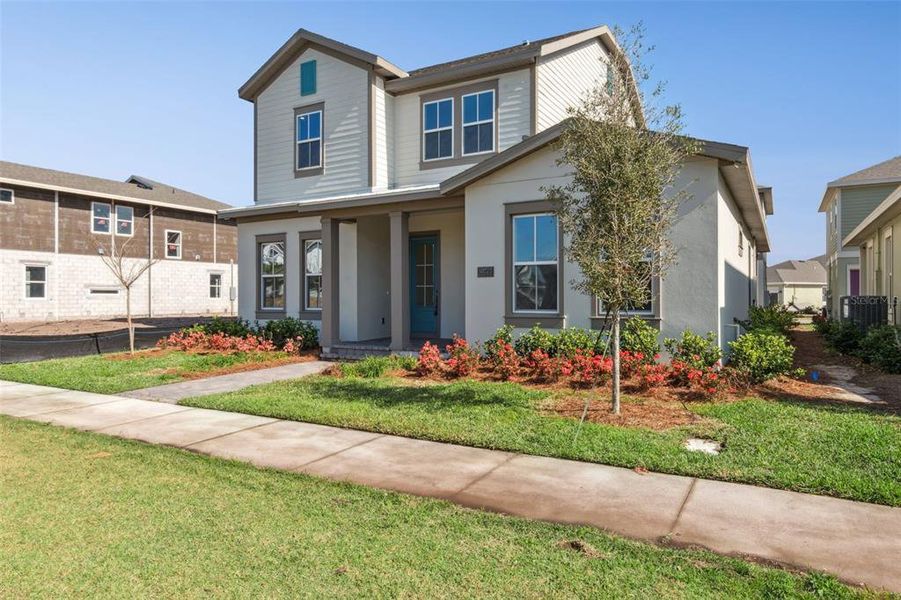 Front exterior of a new home in Laureate Park (Craft Homes), Orlando, FL, highlighting curb appeal (Image 20).