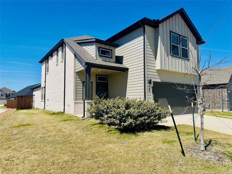Front exterior of a new home in Trails of Lavon, Lavon, TX, highlighting curb appeal (Image 16).