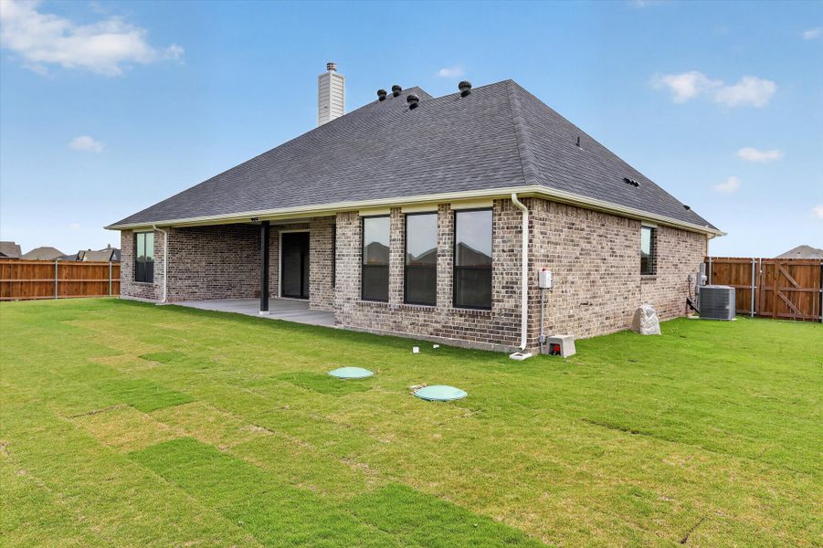 Front exterior of a new home in Coyote Crossing, Godley, TX, highlighting curb appeal (Image 26).