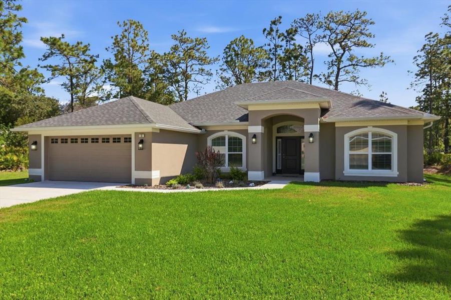 Front exterior of a new home in , Homosassa, FL, highlighting curb appeal (Image 23).