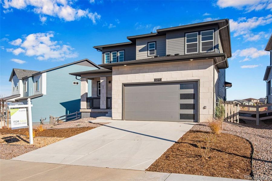 Front exterior of a new home in Prelude at Sterling Ranch, Littleton, CO, highlighting curb appeal (Image 25).