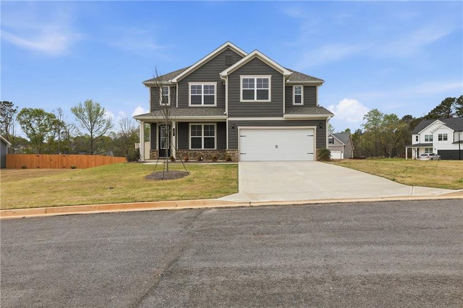 Front exterior of a new home in , Commerce, GA, highlighting curb appeal (Image 30).