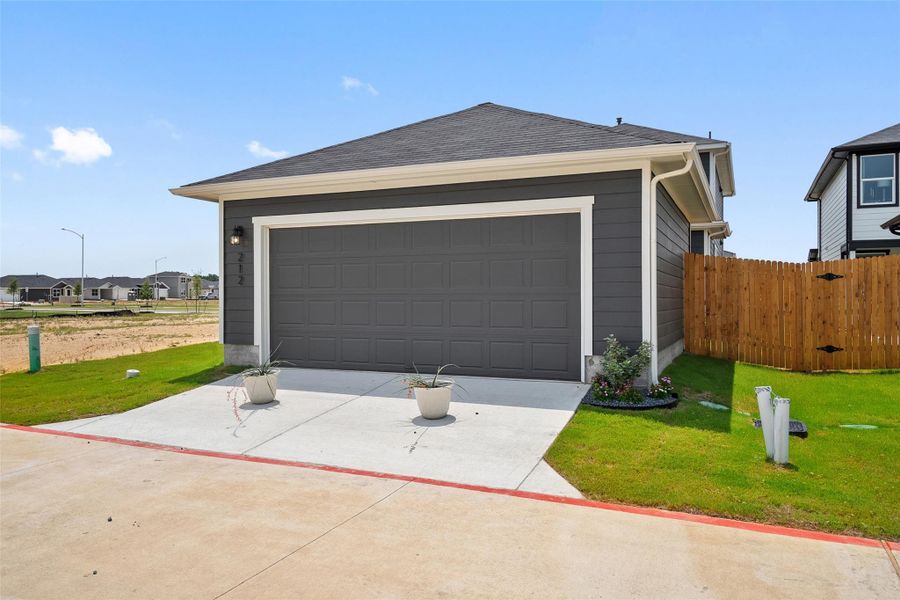 Front exterior of a new home in Valverde, Bastrop, TX, highlighting curb appeal (Image 2). Front exterior of a new home in Valverde, Bastrop, TX, highlighting curb appeal (Image 2).