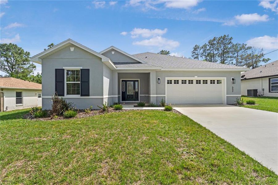 Front exterior of a new home in , Citrus Springs, FL, highlighting curb appeal (Image 25).