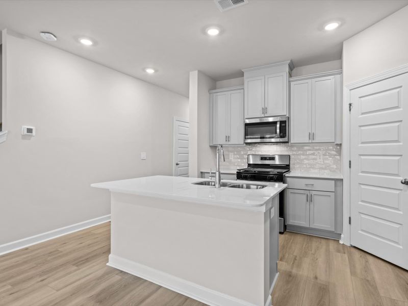 Furnished interior view inside a new home in Crossing at Abner Creek Townes, Greer (Image 6).