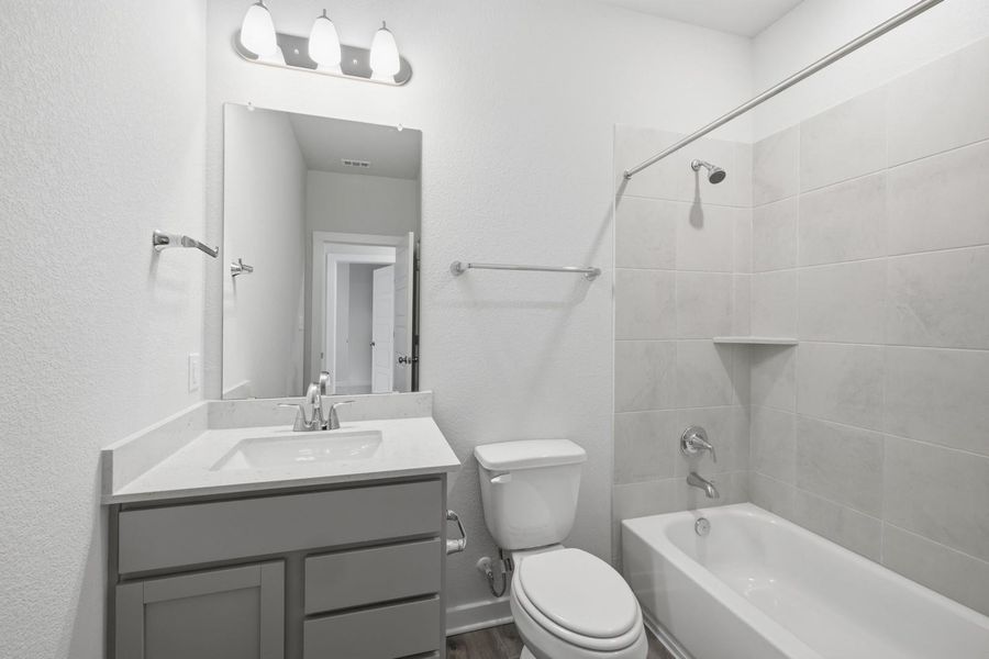 Furnished interior view inside a new home in Stallion Run, Buda (Image 13).