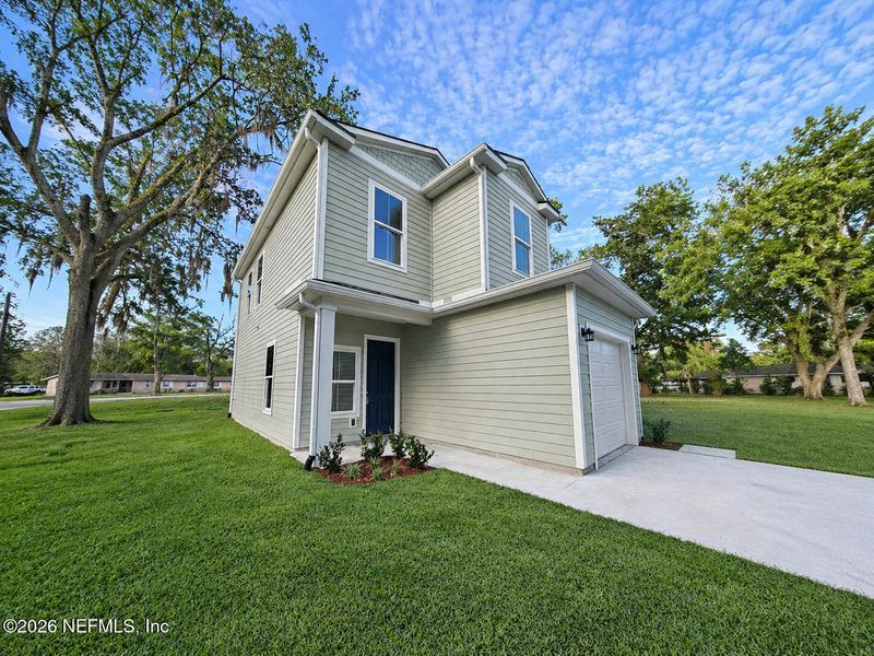 Front exterior of a new home in , Jacksonville, FL, highlighting curb appeal (Image 24).