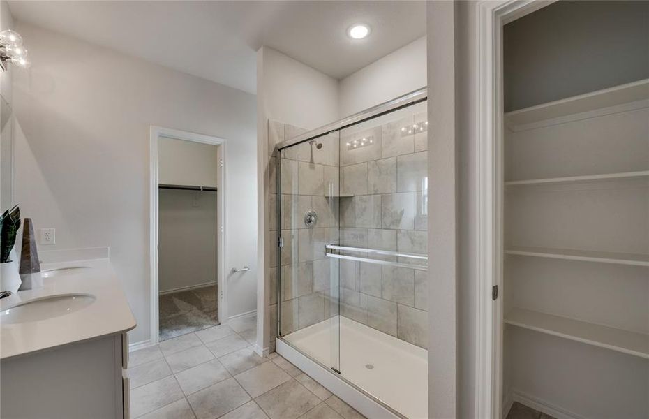 Elegant owner's bathroom with oversized shower *Photos of furnished model. Not actual home. Representative of floor plan. Some options and features may vary.