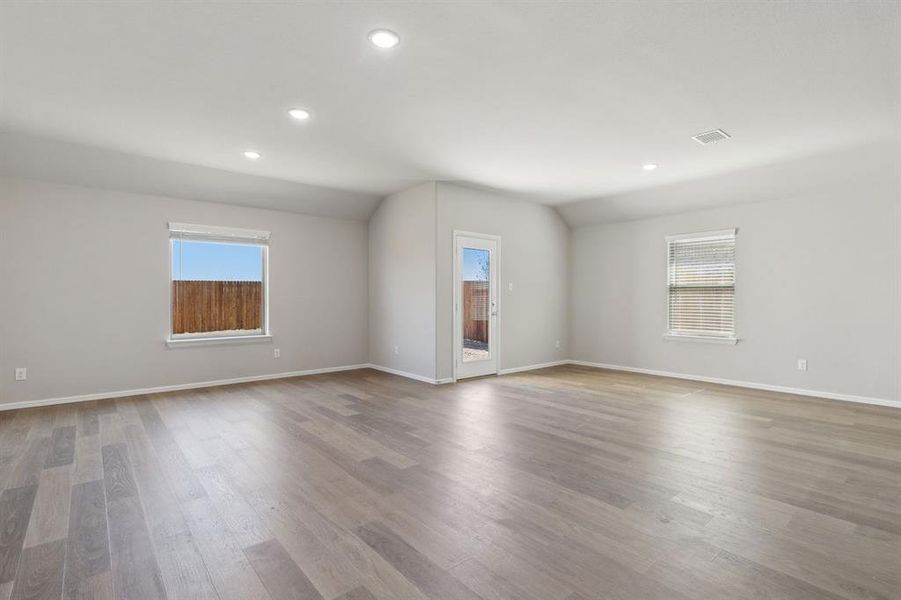 Dining and Living Room in the Harrison home plan by Trophy Signature Homes – REPRESENTATIVE PHOTO