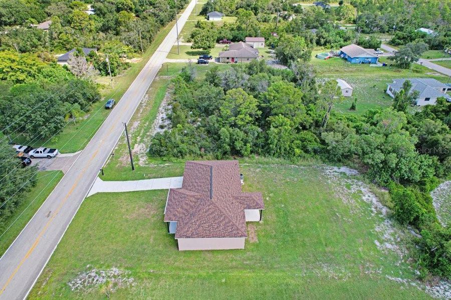 Front exterior of a new home in , Lake Placid, FL, highlighting curb appeal (Image 18). Front exterior of a new home in , Lake Placid, FL, highlighting curb appeal (Image 18).