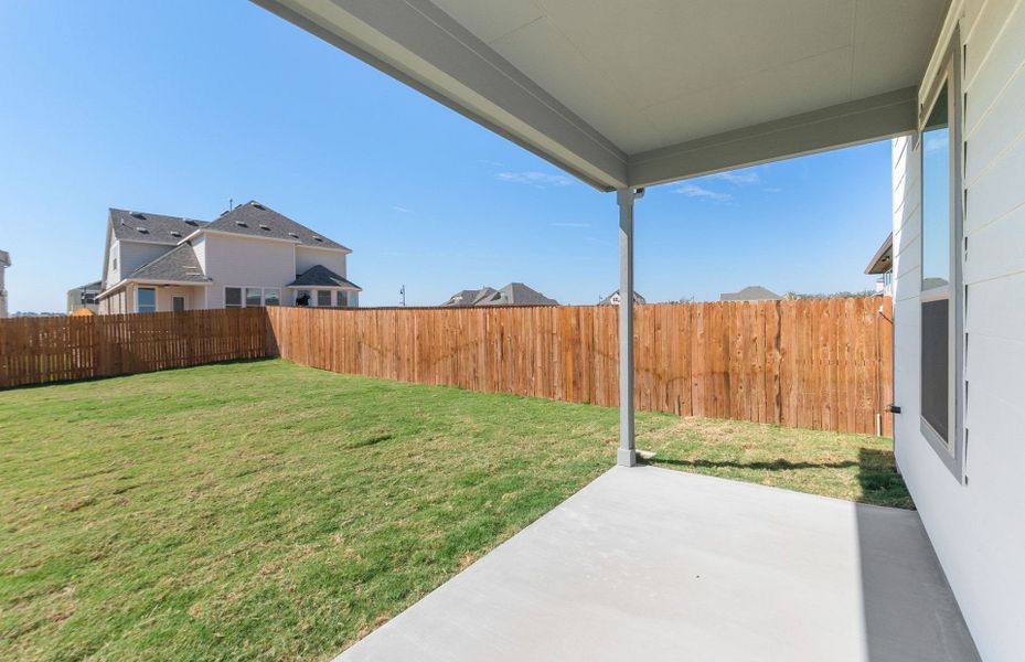 Exterior details and patio area of a home in Saddleback at Santa Rita Ranch, Liberty Hill (Image 20). Exterior details and patio area of a home in Saddleback at Santa Rita Ranch, Liberty Hill (Image 20).