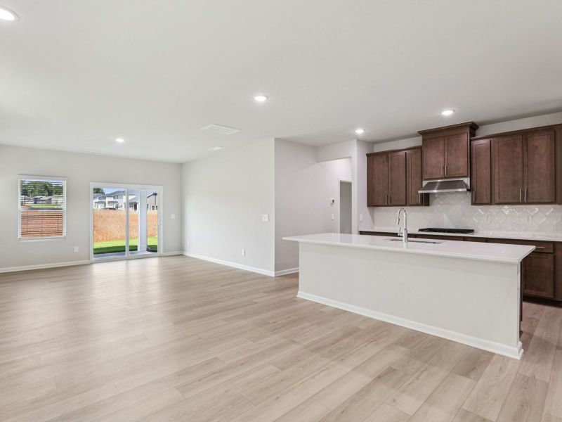 Great room in the Paisley floorplan at a Meritage Homes community in Garner, NC.