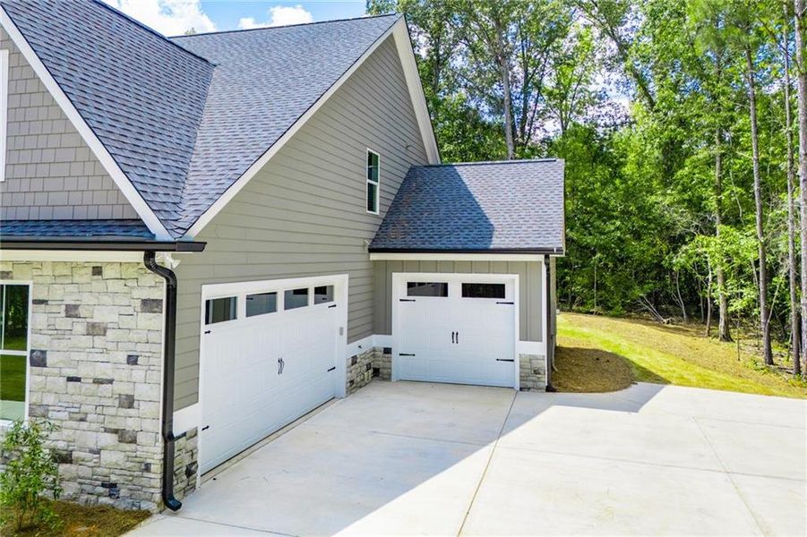 Front exterior of a new home in , Douglasville, GA, highlighting curb appeal (Image 24).