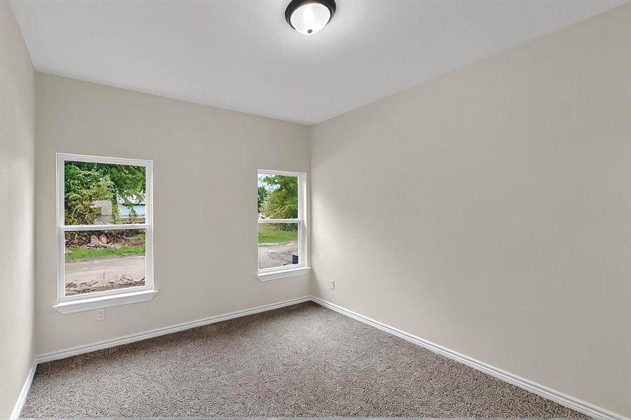 Spare room with baseboards and carpet floors Spare room with baseboards and carpet floors
