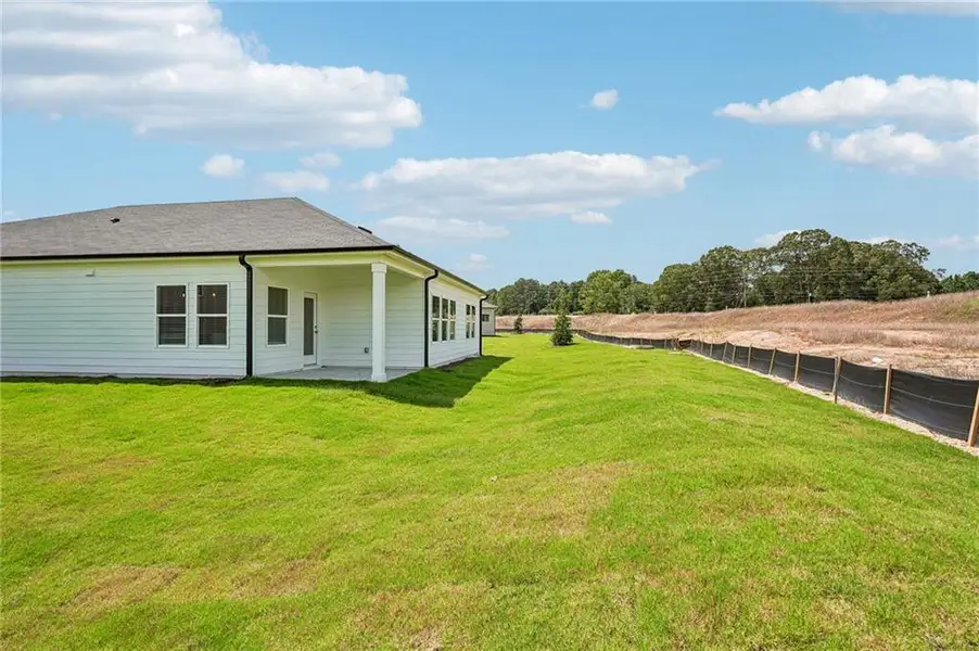 Exterior details and patio area of a home in Northwoods at Mirror Lake, Villa Rica (Image 3).