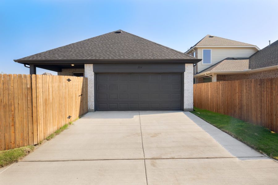 Representative exterior photo of a completed home built from the Hawthorne by UnionMain Homes in Edgewater, Fate, TX (Image 22).