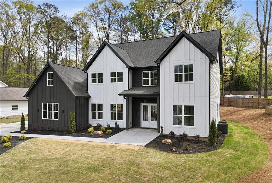 Front exterior of a new home in , Marietta, GA, highlighting curb appeal (Image 27). Front exterior of a new home in , Marietta, GA, highlighting curb appeal (Image 27).