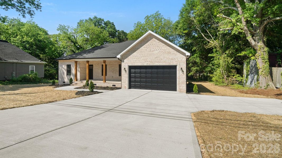 Front exterior of a new home in , Lincolnton, NC, highlighting curb appeal (Image 16).