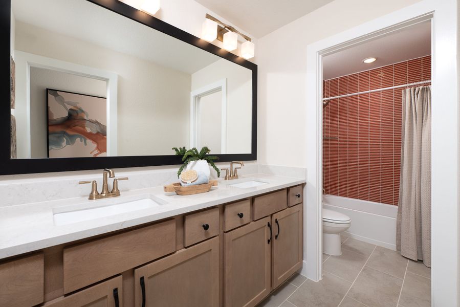 Representative furnished interior of a home built from the Magnolia by Tri Pointe Homes in Landmark, Denton (Image 15).