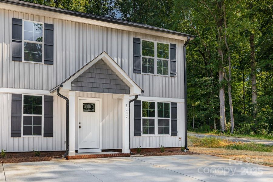 Front exterior of a new home in , Kannapolis, NC, highlighting curb appeal (Image 1).
