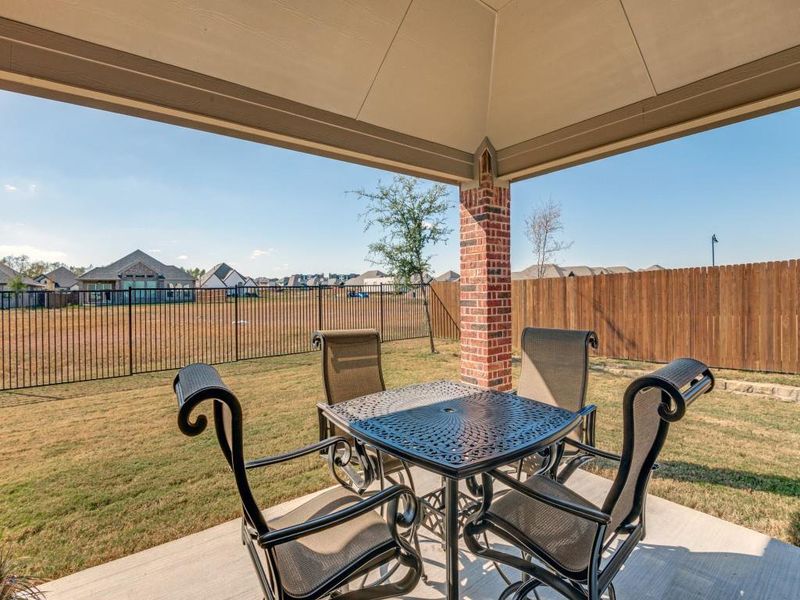 Exterior details and patio area of a home in Oaks of North Grove, Waxahachie (Image 22).