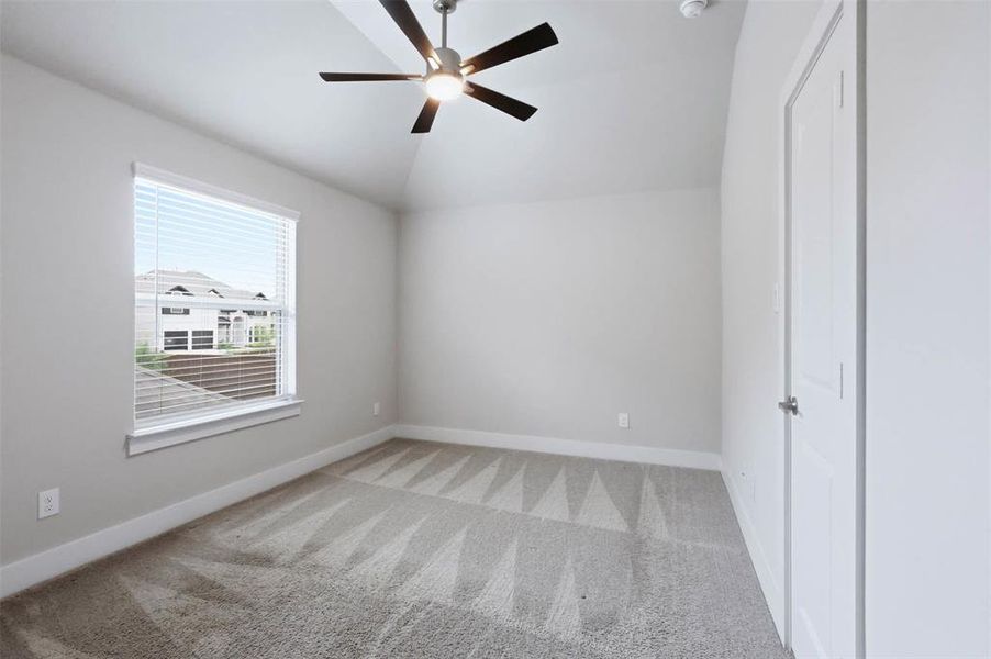 Fifth upstairs bedroom with a private ensuite bathroom, offering a comfortable setup for guests or family.