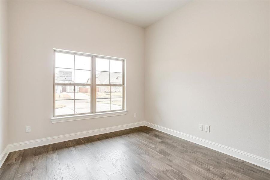 Spare room with hardwood / wood-style flooring