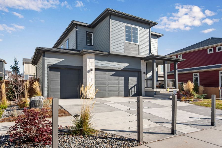 Representative exterior photo of a completed home built from the The Sonata by Tri Pointe Homes in Reunion, Commerce City, CO (Image 2). Representative exterior photo of a completed home built from the The Sonata by Tri Pointe Homes in Reunion, Commerce City, CO (Image 2).