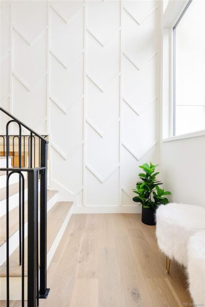 Custom millwork and large windows welcome natural light