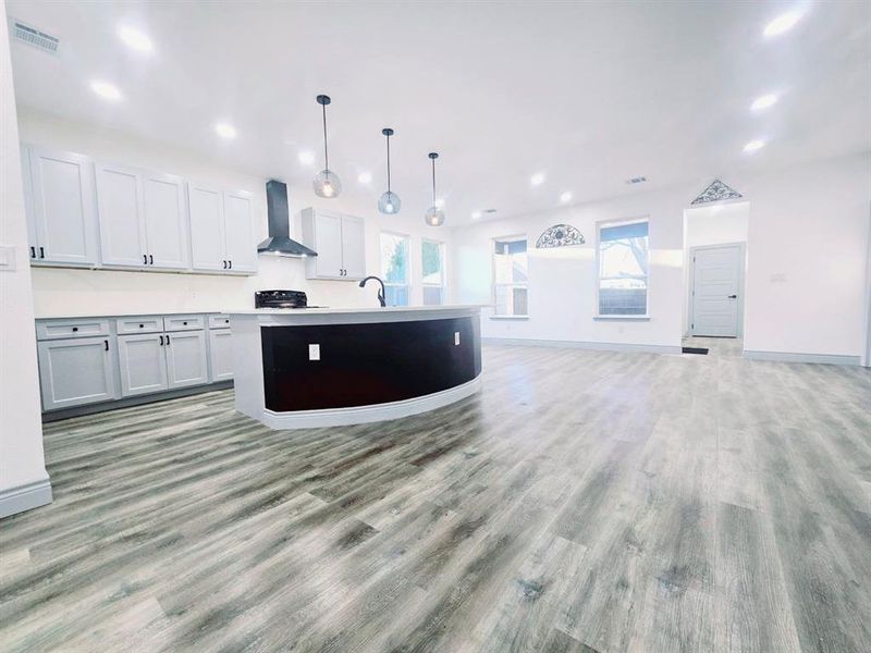 Gorgeous kitchen featuring beautiful light fixtures