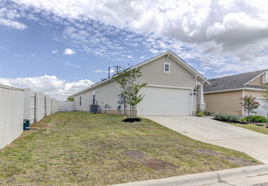 A charming residence with a spacious garage and verdant yard, offering peaceful suburban living. A charming residence with a spacious garage and verdant yard, offering peaceful suburban living.
