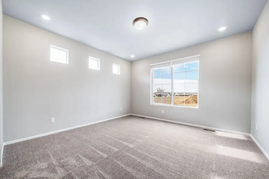 Spacious, unfurnished interior of a new home in The Reserve at Green Valley Ranch, Aurora (Image 20).