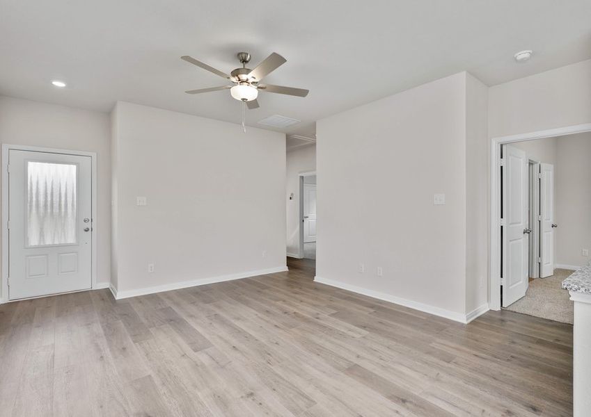 The spacious living room has space for large furniture, so everyone has a seat.