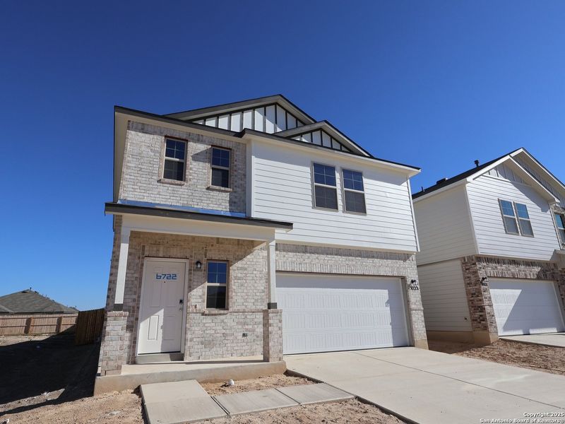Front exterior of a new home in Winding Brook, San Antonio, TX, highlighting curb appeal (Image 19). Front exterior of a new home in Winding Brook, San Antonio, TX, highlighting curb appeal (Image 19).