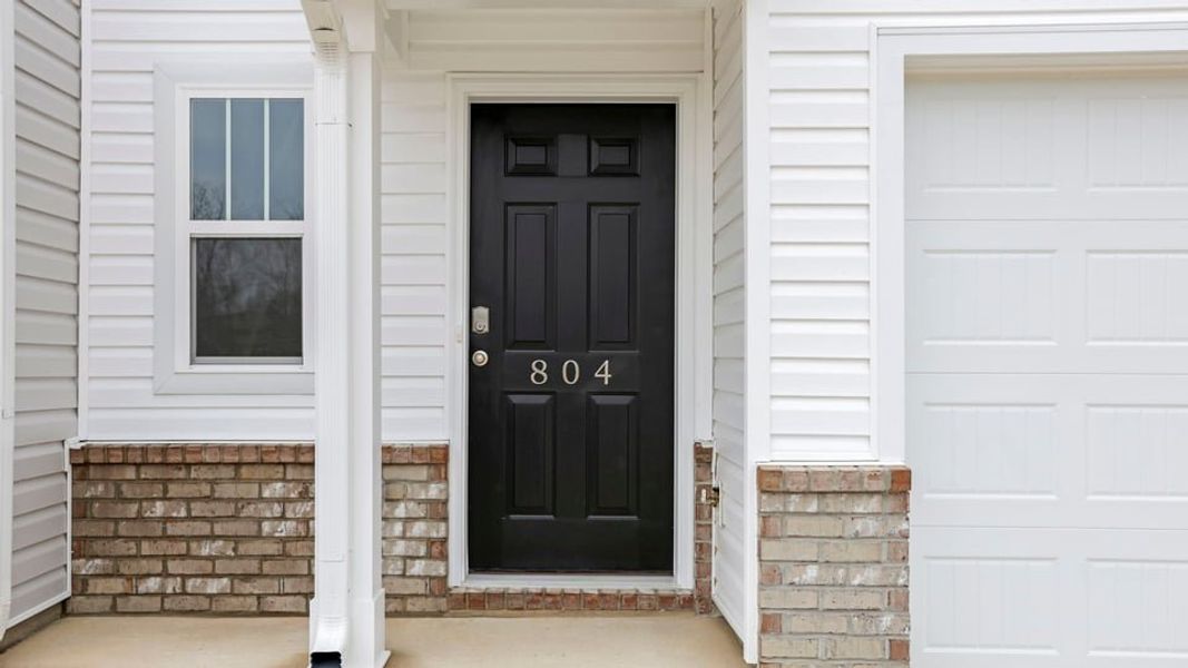 Exterior details and patio area of a home in Covington Village, Greer (Image 4).