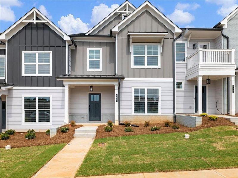 Front exterior of a new home in Apalachee Overlook, Winder, GA, highlighting curb appeal (Image 2). Front exterior of a new home in Apalachee Overlook, Winder, GA, highlighting curb appeal (Image 2).