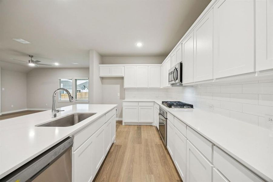 Kitchen in the Oscar home plan by Trophy Signature Homes – REPRESENTATIVE PHOTO Kitchen in the Oscar home plan by Trophy Signature Homes – REPRESENTATIVE PHOTO